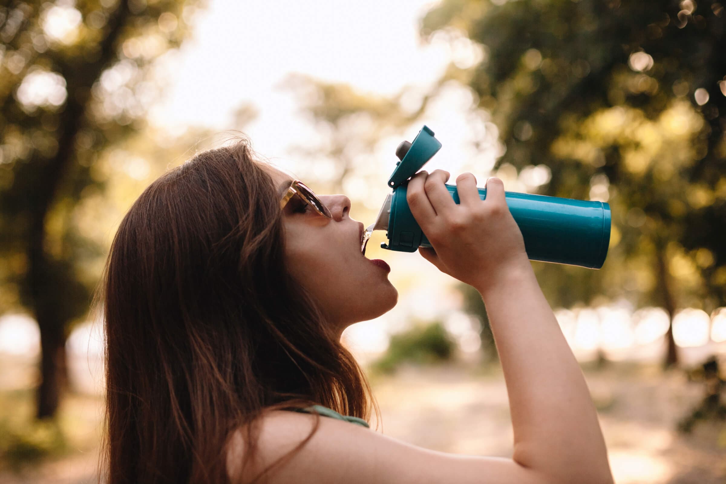Woman drinking water from a water bottle