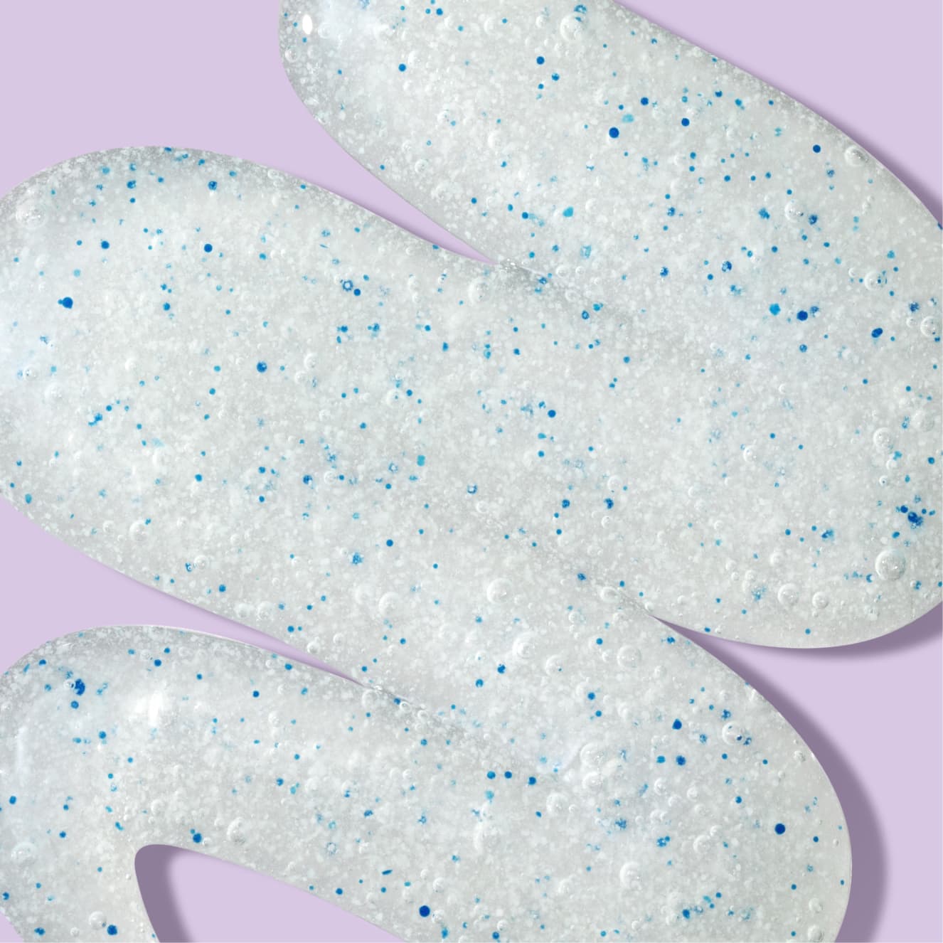 White paste with blue beads over light purple background