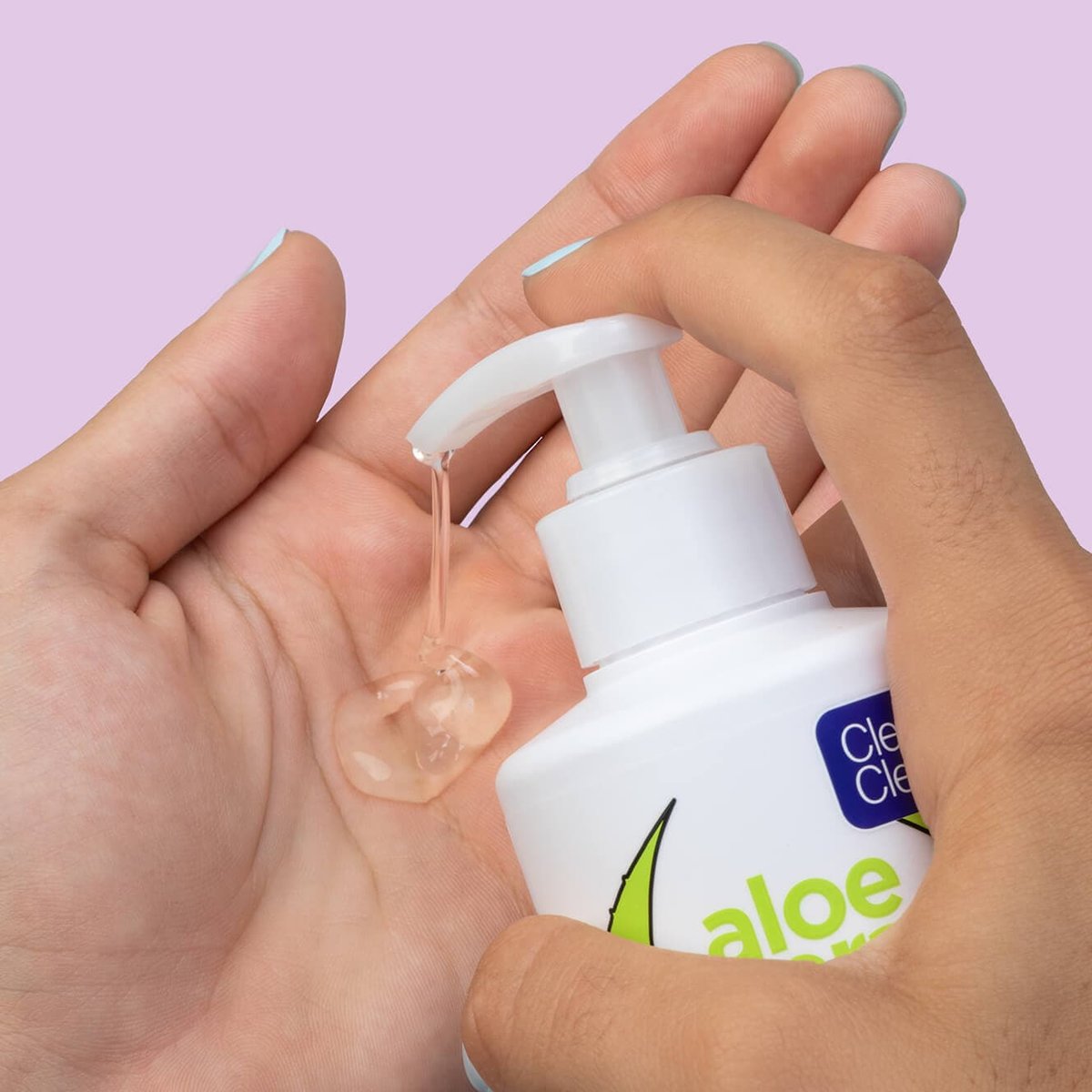White pump bottle pouring cleanser into hand