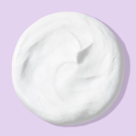 White blob of deep action cream cleanser for sensitive skin over light purple background
